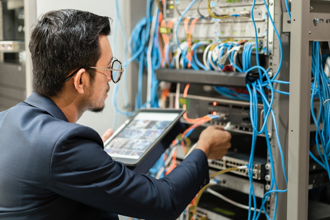 Network Technician Maintaining a Server